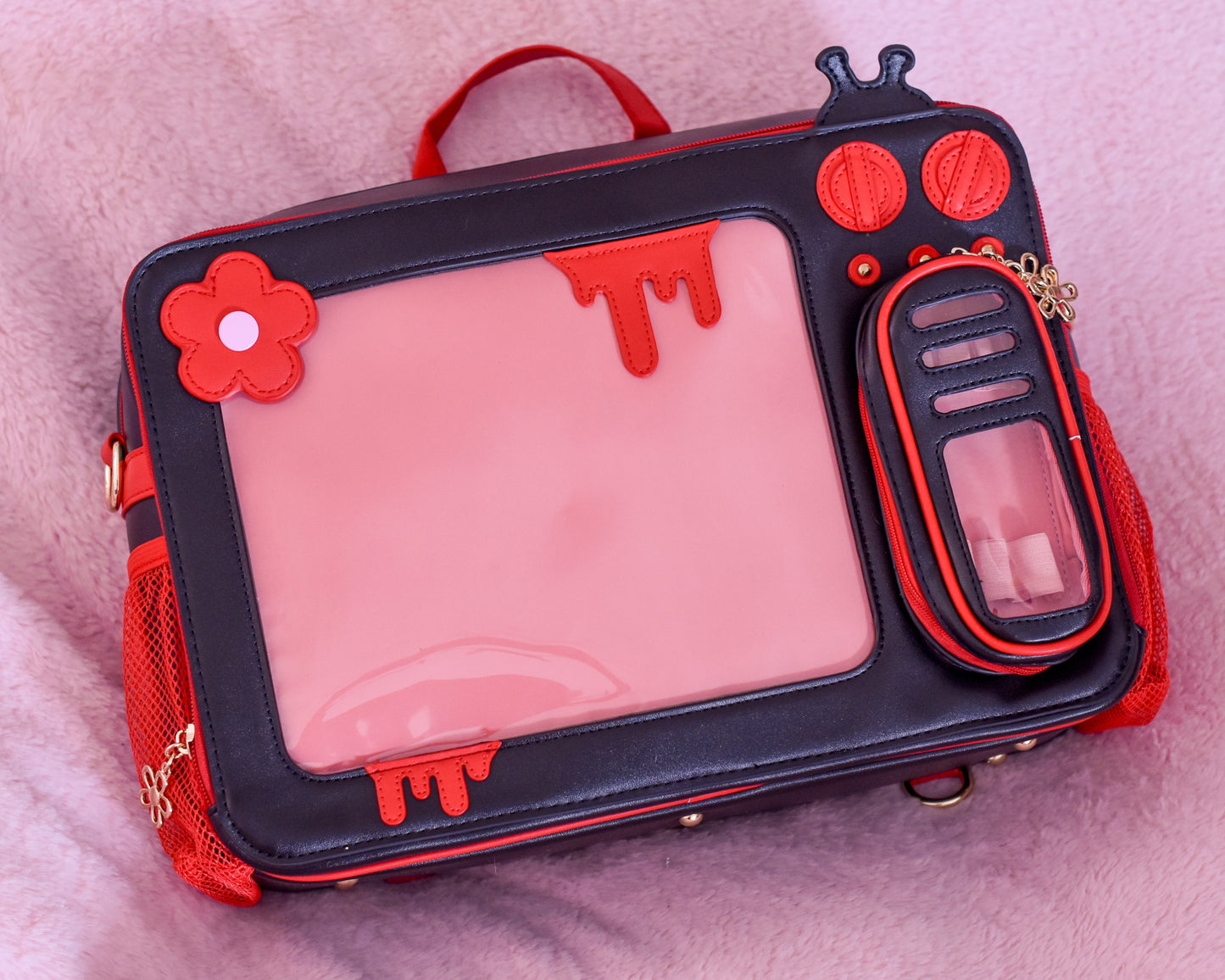 Blood Red TV Head Ita Bag 2.0 with interchangeable straps and padded interior.